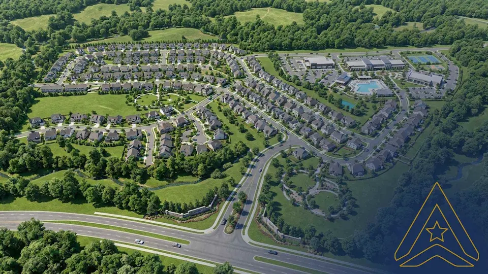 Aerial view of a suburban neighborhood with houses, pool, community spaces, trees, and nearby roads.